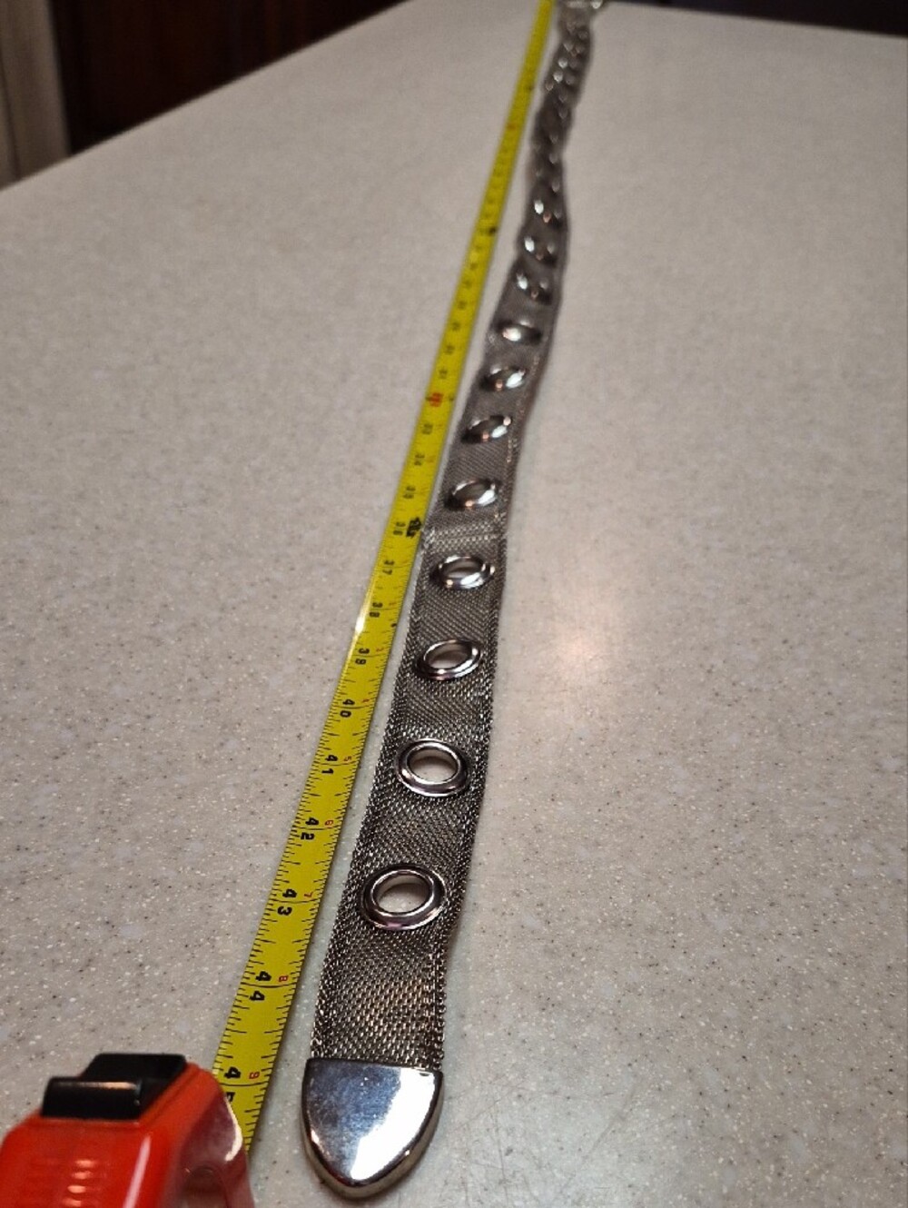 silver-toned metallic belt features a mesh chain construction - Picture 2 of 4